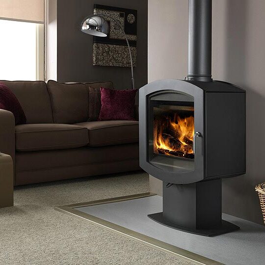 Cozy living room with modern wood stove heating the space.
