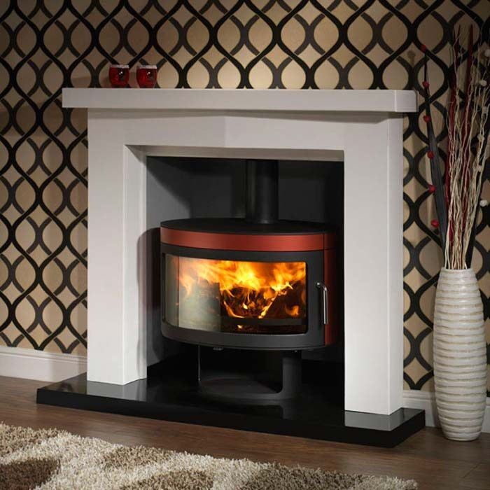 Fireplace with glass door showing a warm fire burning inside.